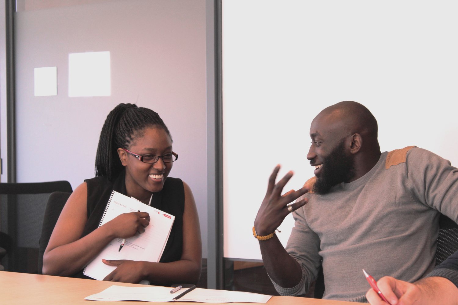 Two founders laughing during a mastermind session